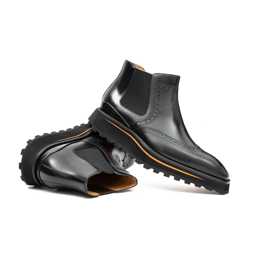 Black Wingtip Chelsea Boots with Brown-Edge Lug Sole