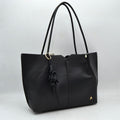 Minimalist Structured Tote Bag with Geometric Cutout and Tassel Accent